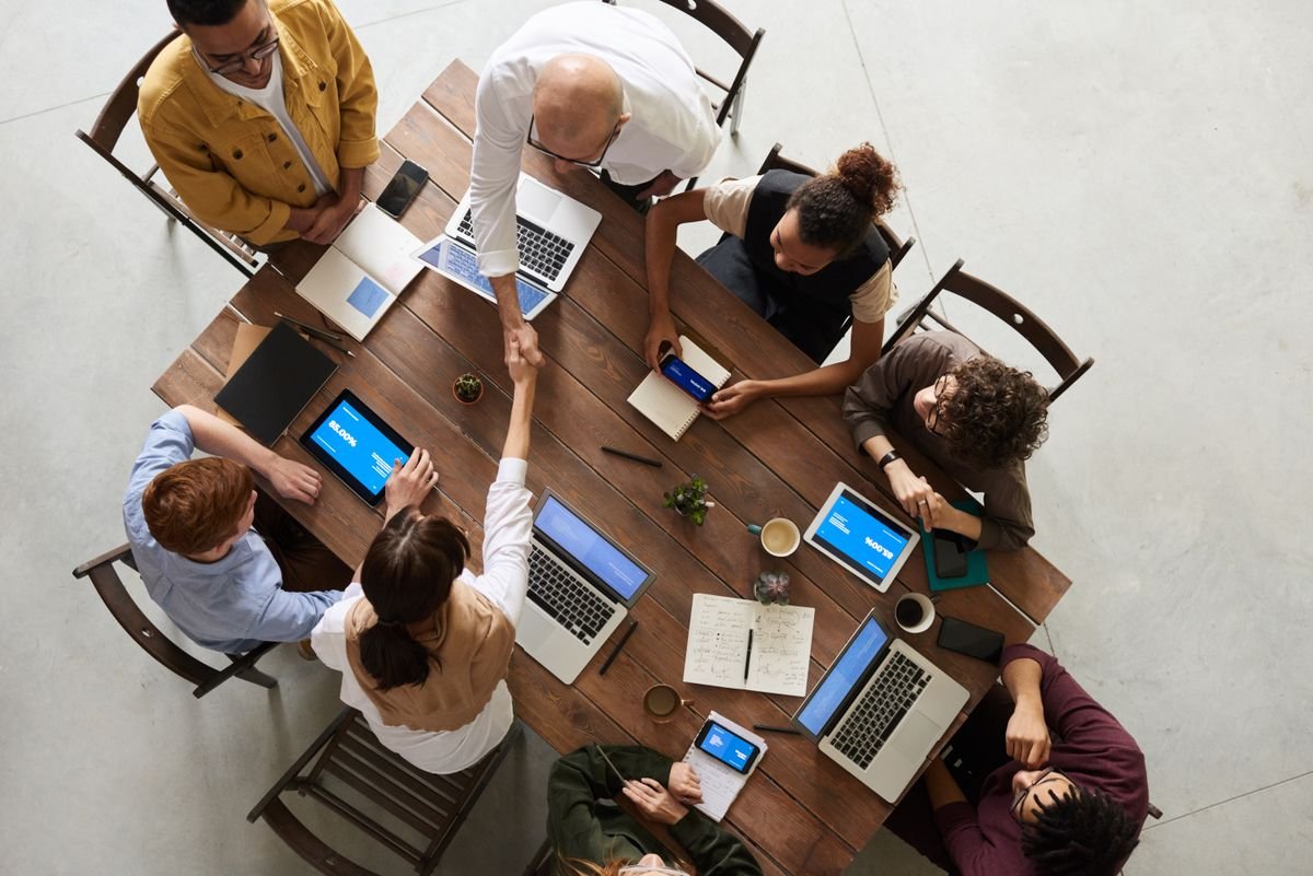 RadArch team collaborating around a table with laptops